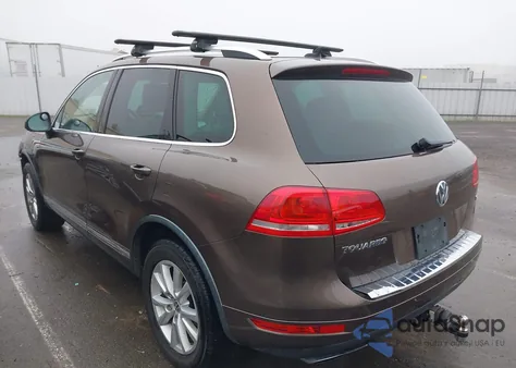 2014 Volkswagen Touareg 3.6L Sport z USA, uszkodzony, nr VIN WVGEF9BP7ED001676